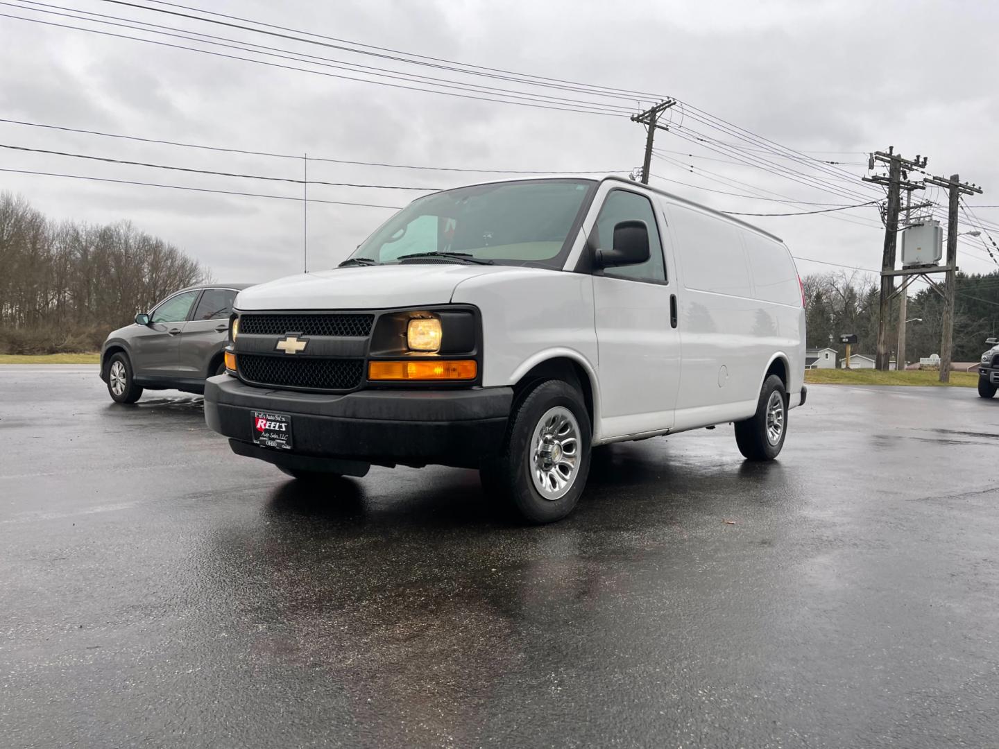 2014 White /Neutral Chevrolet Express 1500 AWD Cargo (1GCSHAF4XE1) with an 5.3L V8 OHV 16V FFV engine, 4-Speed Automatic transmission, located at 547 E. Main St., Orwell, OH, 44076, (440) 437-5893, 41.535435, -80.847855 - Photo#0